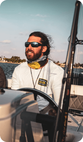 Scott driving a boat